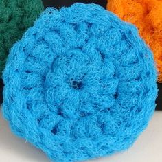 three crocheted balls sitting next to each other