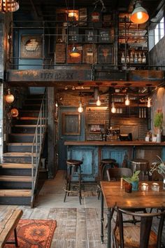 the interior of a restaurant with wooden tables and stools, stairs leading up to an upper floor