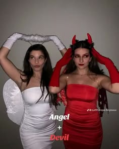 two women dressed in devil costumes posing for the camera with their hands behind their heads