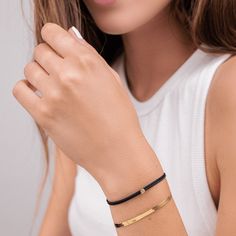 So minimal and chic, it makes a statement without uttering even one word. A tribute to our Classic String of Love, the Cord of Love brings forth an entirely new meaning to less is more. With a bolder cord and lobster clasp closure for easy use every day - this piece will become a staple in your everyday arm stack. Now you can add up to 10 ethically sourced diamonds and get yours set in 18k Rose Gold Vermeil, 18k Gold Vermeil, or 925 Sterling Silver. Elevate any outfit with a versatile yet classi Minimalist Bracelet Strap For Anniversary, Minimalist Yellow Gold Bracelet For Everyday Luxury, Minimalist Yellow Gold Bracelet For Everyday, Minimalist Diamond Bracelet For Formal Occasions, Minimalist Yellow Gold Bracelets For Anniversary, Minimalist Diamond Bracelet With Adjustable Fit, Adjustable Minimalist Yellow Gold Bracelets, Minimalist Adjustable Yellow Gold Bracelets, Minimalist Adjustable Yellow Gold Bracelet