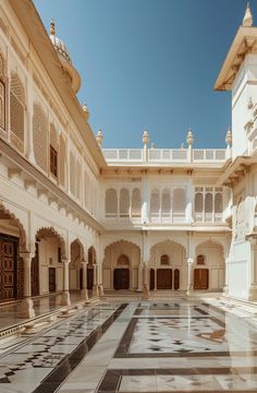 the inside of an ornate building with white and black tiles on the floor, walls and ceiling