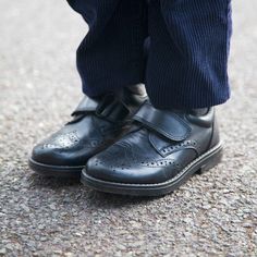 Simple and fuss-free, these school shoes feature a single fastening for an adjustable and comfortable fit, and soft heel and ankle pad to support and protect feet. This style features smart brogueing detail on the toe and is made and lined with 100% premium European leather for comfort. | Trotters London | Gregory School Shoe (Black, Size 28) | Maisonette collects the best children’s products from around the world (unlike Zulily, Etsy, The Tot, Farfetch Kids, Childrensalon, Crate and Kids, Kohls Soft Heels, London Shoes, Boy Accessories, Mini Boden, Buy Buy Baby, School Shoes, Shoes Booties, Sweater And Shorts, Girls Accessories