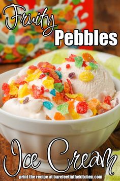 fruit pebbles ice cream in a white bowl on a wooden table next to a box of gummy bears