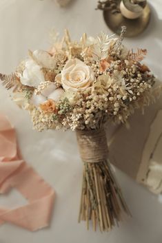 a bouquet of flowers sitting on top of a table