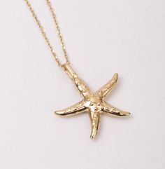 Whispers of the Waves: Allow the waves to whisper eternal tales with our Starfish Urn Pendant in 14K SOLID Gold.  This cremation charm delicately transforms into a memorial necklace--a testament to enduring love.  Dive into the serenity of the sea with this ocean-themed jewelry, a nautical urn necklace that speaks volumes, making it a heartfelt and timeless gift for her. Material: Solid Gold, real gold (not gold-filled or no gold-plated) Available Gold Karat: 14K (585) Available Gold Color: Yell 14k Gold Starfish Charm Jewelry For Gifts, 14k Gold Starfish-shaped Jewelry, 14k Gold Jewelry With Starfish Charm For Gift, Gold Nautical Jewelry With Star Charm, Gold Starfish Charm Jewelry In 14k Gold, Ocean-inspired Gold Jewelry With Star Charm, Gold Jewelry With Starfish Charm In 14k Gold, 14k Gold Jewelry With Starfish Charm, 14k Yellow Gold Starfish Jewelry