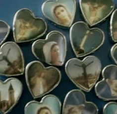 many heart shaped pictures are arranged on a table