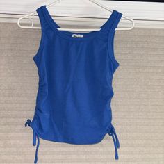 Never Worn Casual Blue Top With Drawstring, Fitted Blue Top With Drawstring, Blue Cotton Drawstring Tops, Blue Stretch Solid Color Tank Top, Black Party Tops, Sporty Blue Compressive Tank Top, High Stretch Blue Moisture-wicking Tank Top, Black Leather Corset, Lavender Tops