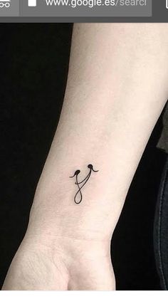 a person with a small tattoo on their wrist