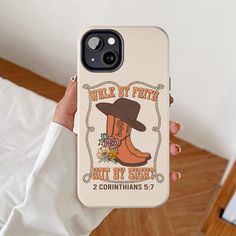 a person holding up a phone case that says walk by faith not by sight 2 corinhans 5 7