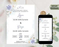 an image of wedding stationery with flowers on it and a phone next to it