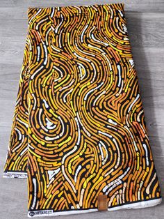 African Ankara Print Fabric. This is fabric is sold by the fold and each fold is approximately a yard.  This fabric is 100% cotton and has a width of 44in.  It can be used make different clothing, quilting and other sewing projects. Purchases of more than a yard, it will come in a continuous piece We ship via USPS First Class Mail, USPS Priority mail or UPS African Fabric For Sale Patterns, Yellow Cotton Fabric With Traditional Patterns, Cotton Fabric With Abstract Pattern, Brown African Print, African Quilts, Clean And Press, Head Wrap Headband, Ankara Print, African Ankara