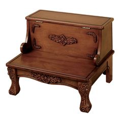 a wooden bench with an ornate design on the top and bottom shelf, sitting in front of a white background