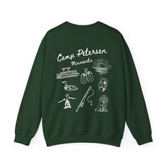 a green sweatshirt with white writing that says camp patern on the front and back