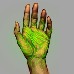 a person's hand with green and yellow lines painted on it, in front of a gray background