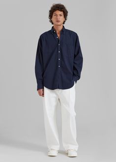 Color: NavyMidweight woven cotton fabric Oversized fitPointed collar Single chest pocketButton cuffsSlight high low hemCurved hemContrast front button closureUnlined100% CottonGentle Machine Wash or Dry CleanImportedOne Size Formal Shirt With Pockets And Relaxed Fit, Oversized Cotton Shirt With Concealed Placket, Formal Cotton Tops With Pockets, Long Sleeve Poplin Shirt With Button Closure, Oversized Cotton Shirt With Button Cuffs, Oversized Cotton Shirt With Fold Down Collar, Relaxed Fit Collared Dress Shirt With Pockets, Relaxed Fit Dress Shirt With Pockets For Work, Cotton Dress Shirt With Concealed Placket For Daywear