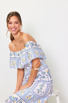 A shoulder-baring maxi dress that's smocked at the back and framed by floaty ruffles at the neckline and hem. Detailed with airy embroidered eyelets, it's got a floral print in a Mediterranean-inspired color palette of blue, white, and yellow. •Sleeveless  •Ruffled at neckline & hem  •Smocked back  •Hidden back zipper  Item Number: 99897 100% COTTON Bohemian Flowy Off Shoulder Dress For Spring, Flowy Bohemian Off Shoulder Dress For Spring, Flowy Bohemian Off-shoulder Dress For Spring, Summer Off Shoulder Maxi Dress With Ruffles, Ruffled Off Shoulder Maxi Dress For Summer, Flowy Ruffled Off Shoulder Dress For Summer, Flowy Off Shoulder Ruffle Dress For Summer, Flowy Off Shoulder Dress With Ruffles For Summer, Flowy Off-shoulder Ruffle Dress For Summer