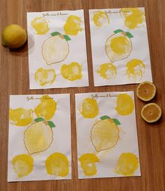 four pieces of paper with lemons cut in half on top of a wooden table