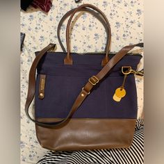 Nwot- Navy And Brown Leather Navy Leather Shoulder Bag With Detachable Handle, Blue Canvas Shoulder Bag With Top Handle, Blue Satchel For Everyday Use, Blue Tote Laptop Bag For Travel, Everyday Blue Leather Laptop Bag, Blue Bags With Leather Handles For Everyday, Blue Leather Laptop Bag For Everyday Use, Blue Bags With Leather Handles For On-the-go, Navy Bags With Detachable Double Handle