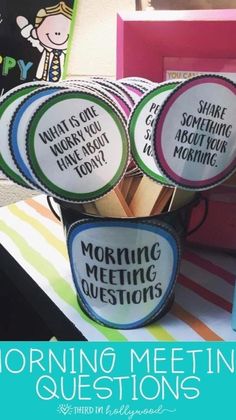 the morning meeting questions are in cups with stickers on them to help students practice their reading skills