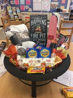 a table topped with lots of candy and snacks