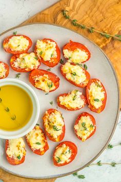 stuffed tomatoes with cheese and olive oil on a plate