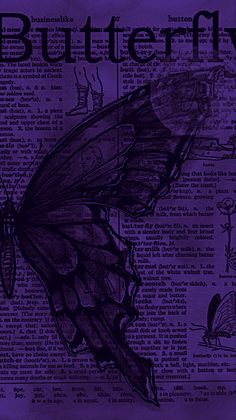 a purple butterfly sitting on top of an old book