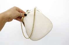 "Beautiful small handheld pouch with gold chain. Will be great for times when you only need to bring phone and money with you, bring it to wedding, events, markets, fairs etc. Would look cool if you hang it on your belt. There are some barely noticeable dirty spots and the lining has some stains (please see photos closely), otherwise the bag is in great vintage condition. Measurements: Width: 7\" (18 cm) Length: 7.9\" (20 cm) Length with the chain: 14.2\" (36 cm) Tag: Guldhuvudet, made in Sweden Bag With Chain, Bring It, Online Retail, Clutch Handbag, Look Cool, Evening Clutch Bag, Hand Bag, Latvia, Purses And Handbags