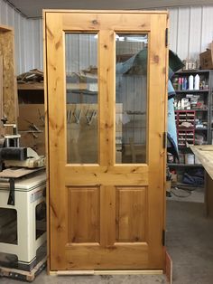 a wooden door with glass in a shop