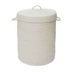 a white rope storage basket with handles on the top and bottom, in front of a white