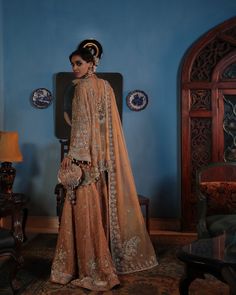 Buy Pakistani Wedding Dress in Sharara Kameez Dupatta Style, a breathtaking masterpiece adorned with hand-crafted details of pearls, tilla, and silverwork. Wedding Anarkali Set With Intricate Embroidery In Jamawar, Elegant Semi-stitched Wedding Dress With Traditional Drape, Wedding Anarkali Set In Raw Silk With Pearl Embroidery, Wedding Sharara With Dabka Work In Jamawar, Intricately Embroidered Raw Silk Salwar Kameez For Weddings, Intricate Embroidered Raw Silk Salwar Kameez For Wedding, Intricate Embroidered Raw Silk Sharara For Wedding, Intricately Embroidered Raw Silk Sharara For Wedding, Anarkali Style Jamawar Sharara For Wedding