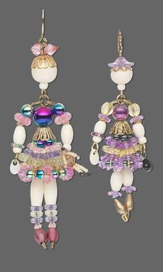 two pairs of earrings with beads and charms on them, one is wearing a dress