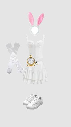 a white dress with bunny ears and an alarm clock on the front, along with other accessories