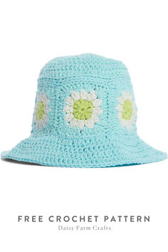 a blue crochet hat with white flowers on it and the words free crochet pattern daily farm crafts