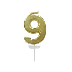 the number nine cake topper is gold