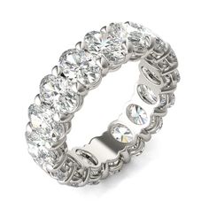 a white gold ring with six rows of round cut diamonds on the inside and outside