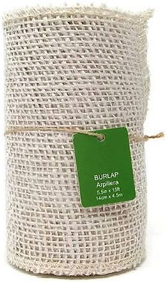 a roll of burlap is wrapped in jute and has a green tag on it