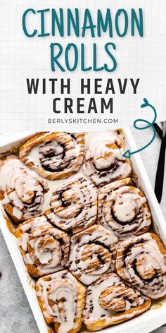 cinnamon rolls with heavy cream in a white baking dish on a gray surface and text overlay that reads, cinnamon rolls with heavy cream