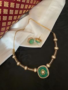 Finish your look with elegance in this timeless jewelry set! Trendy and stylish necklace embedded with Polki Kundan, beautiful gold inlay on mint green doublet stone finished with American diamond detailing. Overall Gold Finishing. Matching earrings included. Speciality chain adjustable. Traditional Look Contemporary Concept!! Exclusively created to add that special touch to your personal event!! ✅Check other styles available in our store https://www.etsy.com/shop/KKsCulture ✅Please check item dispatch times before placing order. 💕Send us an email if you need help! ✅ Contact Us: +1 (732) 325-2222 Luxury Hallmarked Yellow Gold Kundan Necklace, Luxury Kundan Chandbalis With Peacock Design, Luxury Meenakari Chandbalis For Designer Wear, Stylish Necklace, American Diamond, Wedding Jewelry Sets, Timeless Jewelry, Indian Jewelry, Mint Green