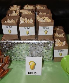 a table topped with boxes filled with popcorn