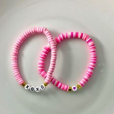 🌸 Sign up for the Starfish by Kristan email list and get 15% off your order NOW! https://mailchi.mp/13833f6189a3/new-customers 🌸 Looking for high quality, affordable jewelry?  If so, this bracelet is for you!  This adorable personalized heishi bead Valentine's bracelet is personalized just for you!   Simply pick which style you like and add your name (up to 7 characters) in the space provided.  Listing is for ONE BRACELET of your choosing. OUR BRACELETS ARE... *Made with high quality lava stones, semi-precious beads, silver, and glass beads *Tarnish free silver wire & gold wire, 925 silver, 1mm stretch cord, waxed linen cord *Crafted in house *Available in various sizes (see photo) CARE INSTRUCTIONS *Remove before swimming or showering *Do not use harsh chemicals  *Roll bracelet over han Personalized Pink Jewelry For Festivals, Pink Heishi Beads Friendship Bracelets For Festival, Bohemian Bracelets With Colorful Beads For Valentine's Day, Bohemian Bracelet With Colorful Beads For Valentine's Day, Pink Bohemian Bracelets For Valentine's Day, Bohemian Pink Bracelets For Valentine's Day, Pink Letter Beads Bracelets For Festival, Pink Letter Beads Stretch Bracelet For Festival, Pink Letter Beads Bracelet For Festival