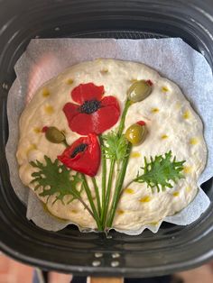 there is a cake decorated with flowers and leaves