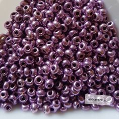 the beads are shiny and purple in color