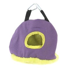 a purple and yellow cat house with a black handle