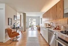 the kitchen is clean and ready to be used as a living room or dining area