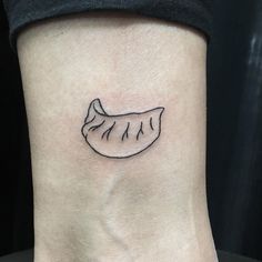 a small tattoo on the ankle of a woman