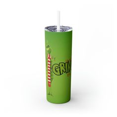 a green tumbler with the word grin on it and a straw sticking out of it