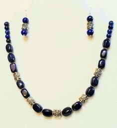 "Gorgeous Lapis Lazuli, is the star in this amazing 2 Piece Vintage Beaded Gemstone Statement Jewelry Set. See Photos #1-3. - On the Necklace, Lapis Lazuli at center is 4 large Oval (Egg) Beads, separated by a stunning Antiqued Silver Plated 2\" Floral Vintage Pendant drop. - Lapis Lazuli 10mm Beads, some with stunning Antique 925 Sterling Silver Floral Bead End Caps, pair with 8 and 4mm Beads. - 20\" Necklace Length. See Photo #4. - Hook and Eye EZ Clasp Matches the Pendant in Vintage Antiqued Silver Lapis Lazuli Jewelry With Polished Beads, Lapis Lazuli Jewelry With Silver Beads For Gifts, Adjustable Jewelry With Silver Oval Beads, Adjustable Jewelry With Oval Silver Beads, Silver Beaded Lapis Lazuli Jewelry, Lapis Lazuli Jewelry With Silver Round Beads, Heritage Jewellery, Lapis Lazuli Jewelry, Lapis Lazuli Earrings