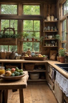 a kitchen filled with lots of wooden furniture and windows