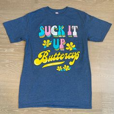 Nwt Simply Southern Short Sleeve Shirt. Suck It Up Buttercup Graphic On Front. Size Adult Small. Blue Top With Funny Print, Fitted Blue Tops With Funny Print, Fitted Blue Top With Funny Print, Fun Blue Tops With Slogan, Blue Shirt With Funny Print For Spring, Trendy Blue Top With Funny Text, Trendy Blue Shirt With Funny Print, Trendy Blue Shirt With Text Print, Blue Summer Shirt With Funny Text