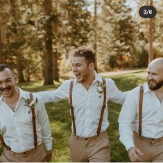 three men wearing brown suspenders and white shirts